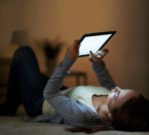 Woman reading digital tablet