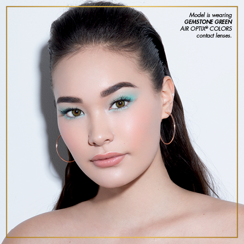 Model is wearing Gemstone Green AIR OPTIX COLORS contact lenses.